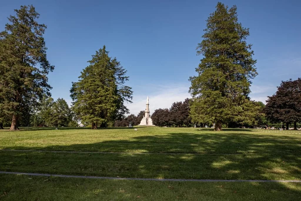 Soldiers' National Monument standing among tall trees in Gettysburg National Cemetery