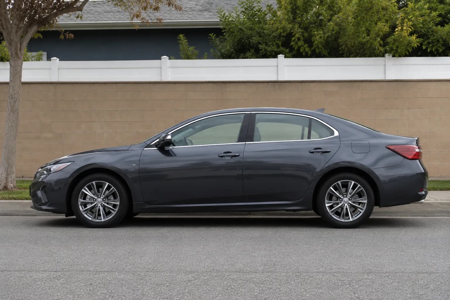 Executive sedan parked in front of a building