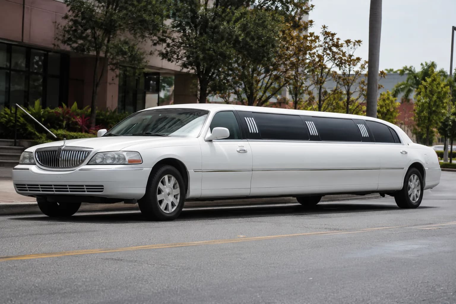 Stretch limousine parked outside a venue